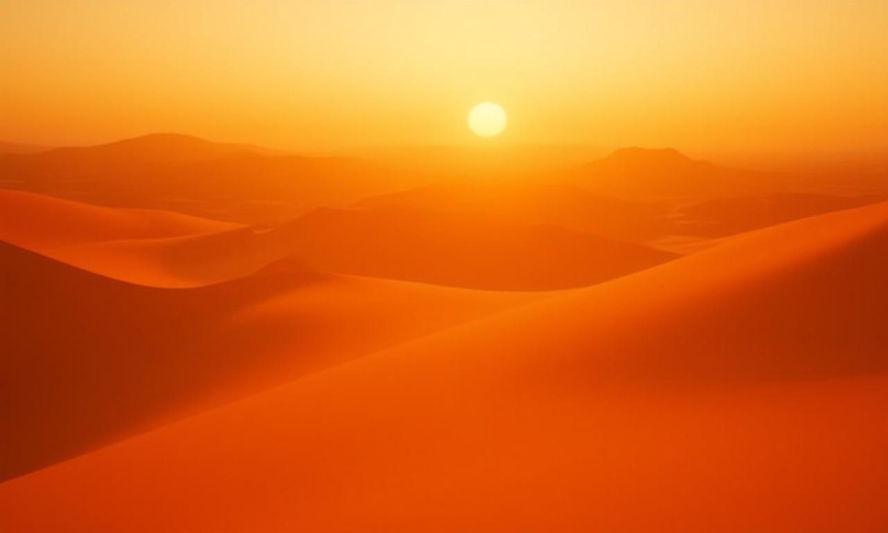 Vast golden desert dunes at sunset